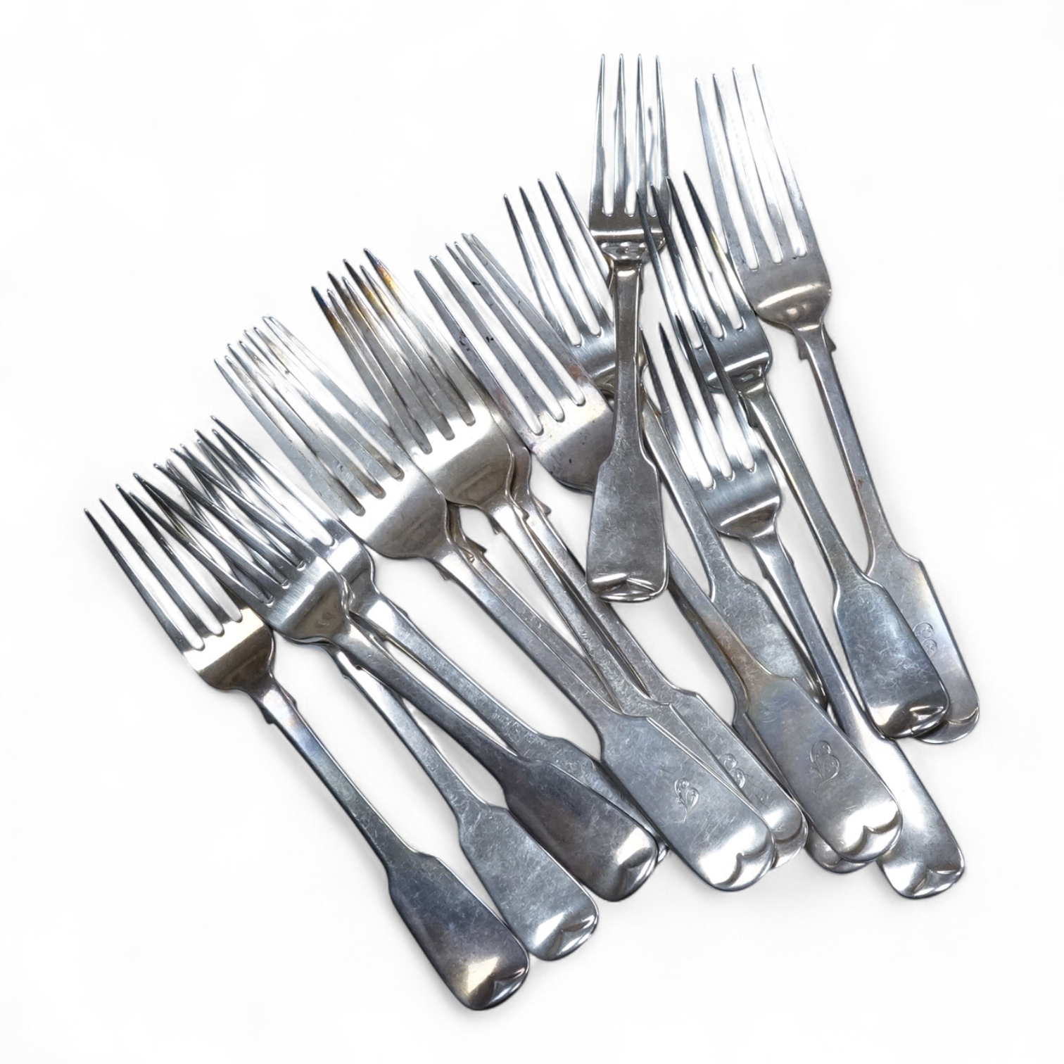 A set of eight William IV Irish silver fiddle pattern dessert forks, by William Cummins, Dublin, 1835, 17.1cm, together with a set of seven late Victorian silver fiddle pattern table forks, Elkington & Co, Birmingham, 18
